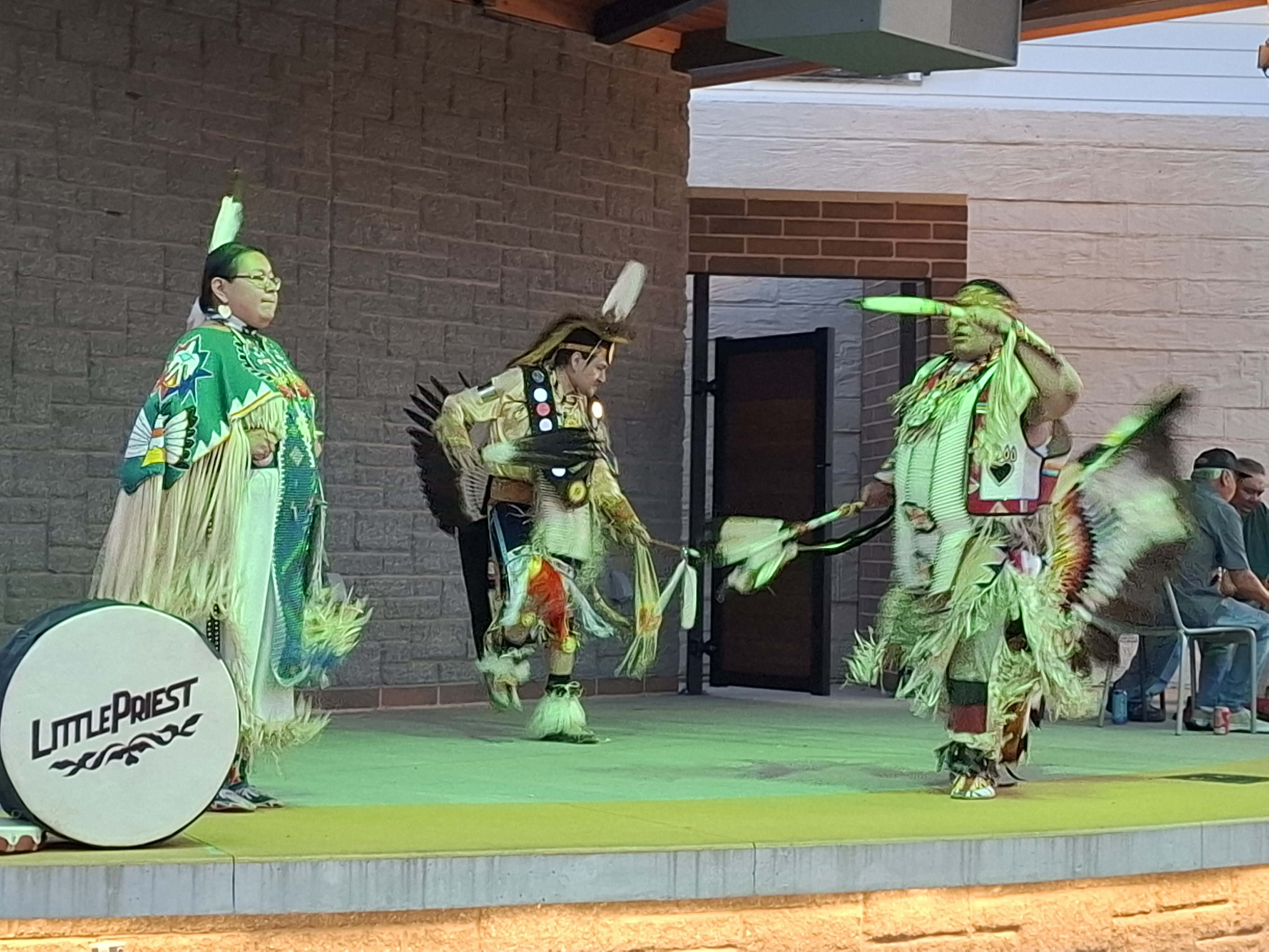 Little Priest Singers performing traditional music and dance at Elm Street Plaza